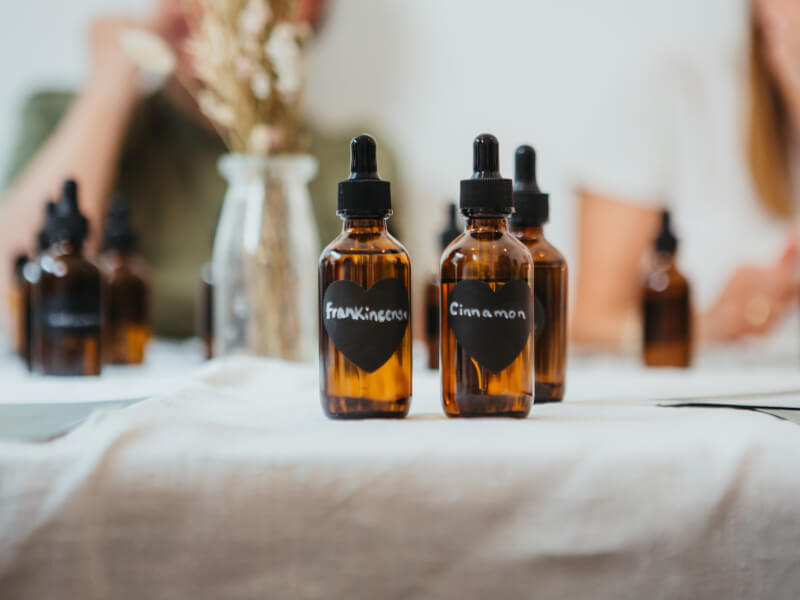 Three labelled dropper bottles on a linen table cloth